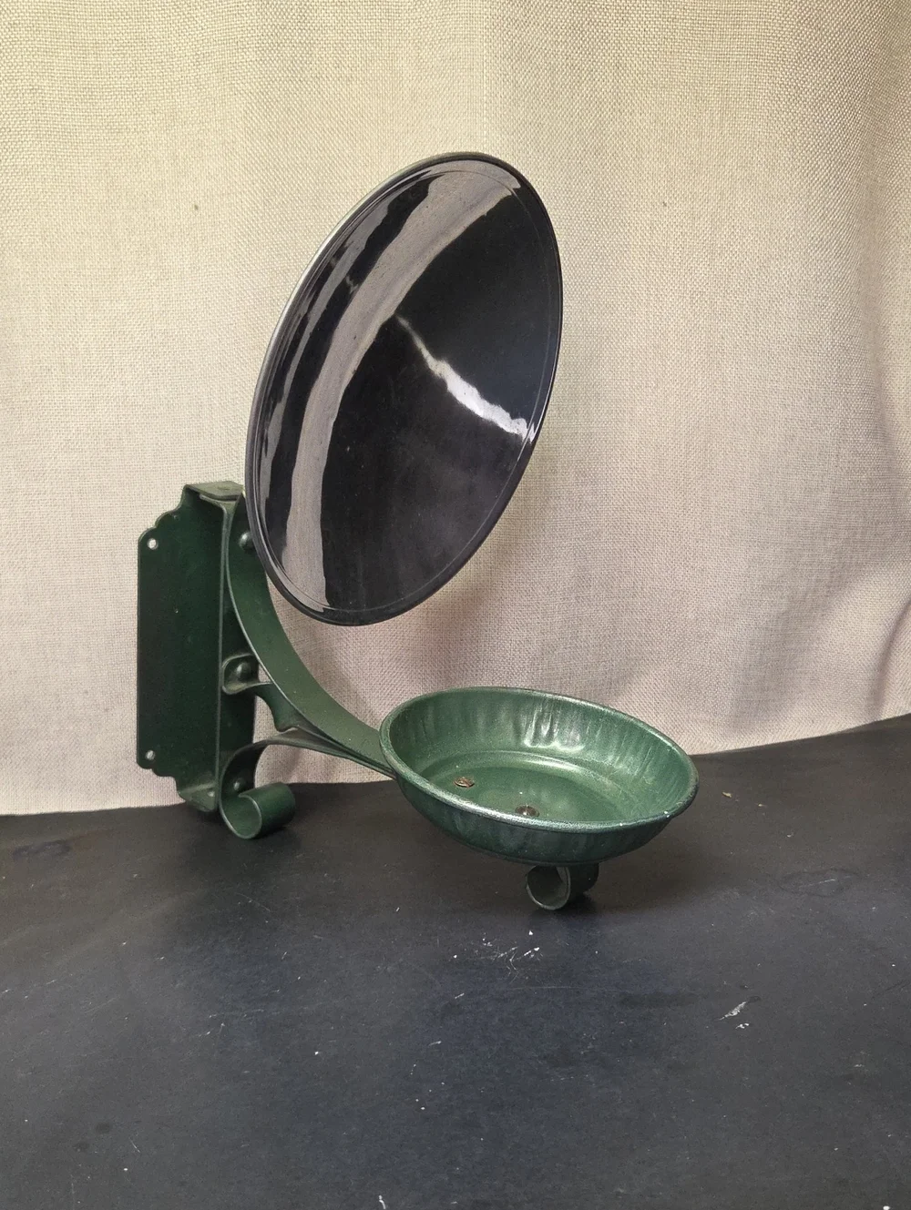 antique‎ cast iron Oil Lamp sconce with a built-in metal reflector.